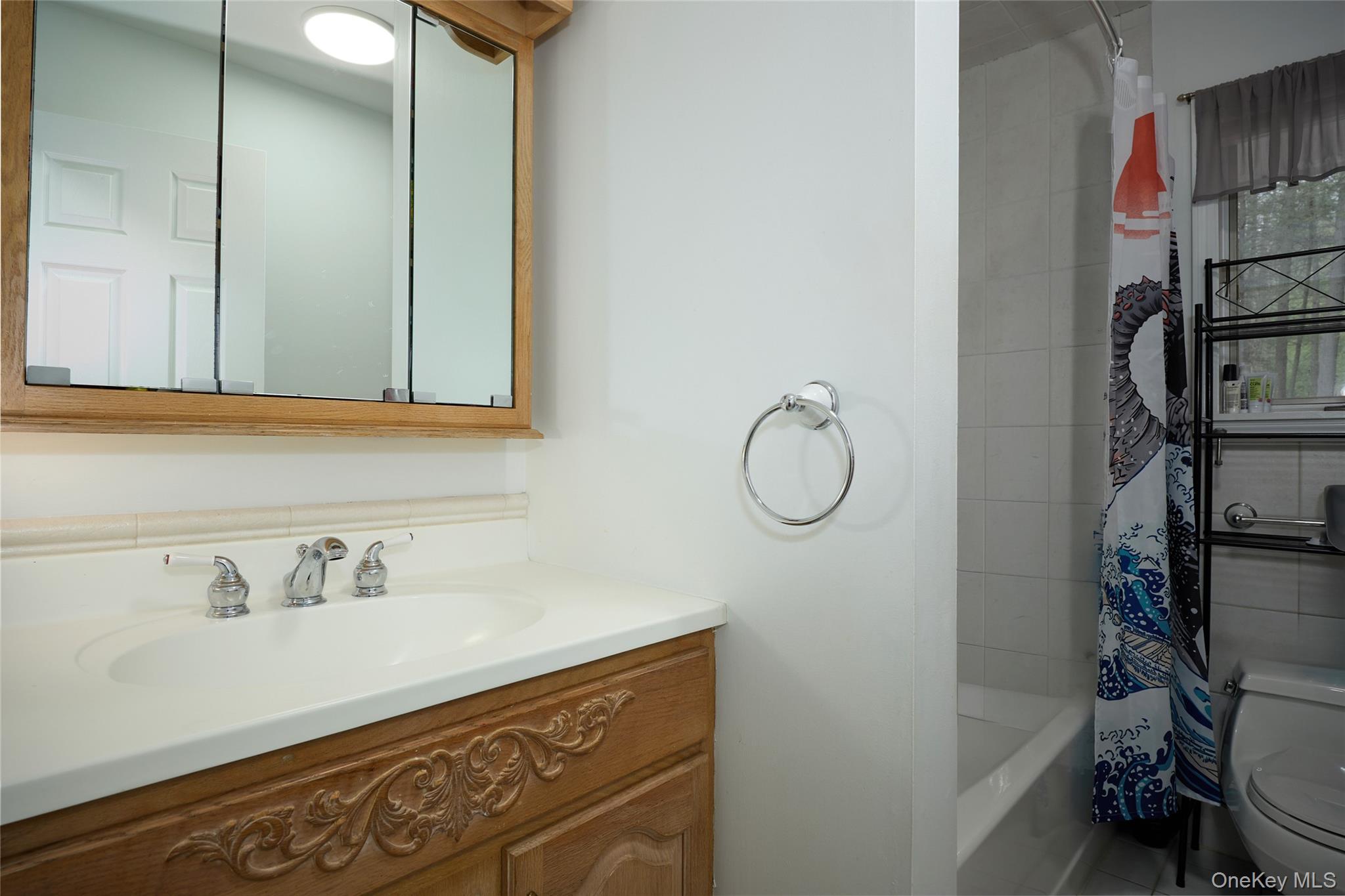34 Maple Brook Road Tuxedo Park, NY 10987 - Photo 14 of 25 a bathroom with a sink and cabinets