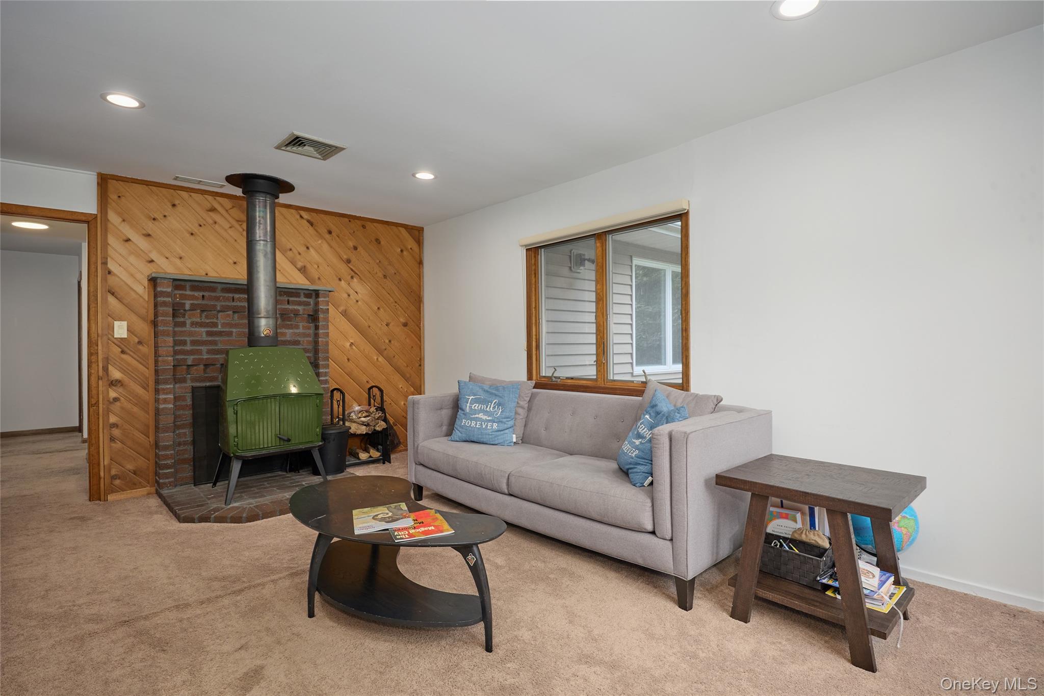 34 Maple Brook Road Tuxedo Park, NY 10987 - Photo 20 of 25 a living room with furniture and a fireplace