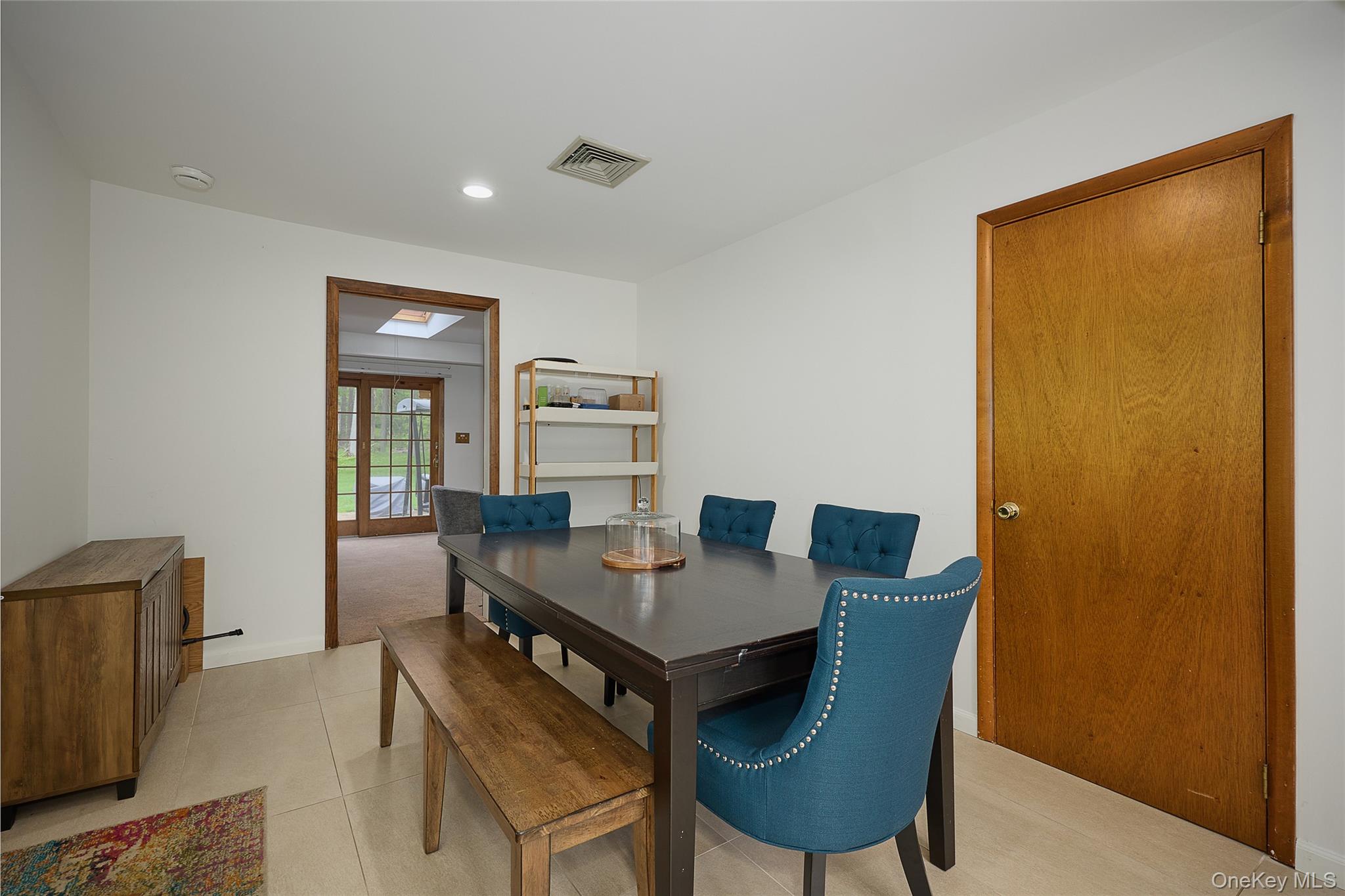 34 Maple Brook Road Tuxedo Park, NY 10987 - Photo 3 of 25 a view of a dining room with furniture and a window