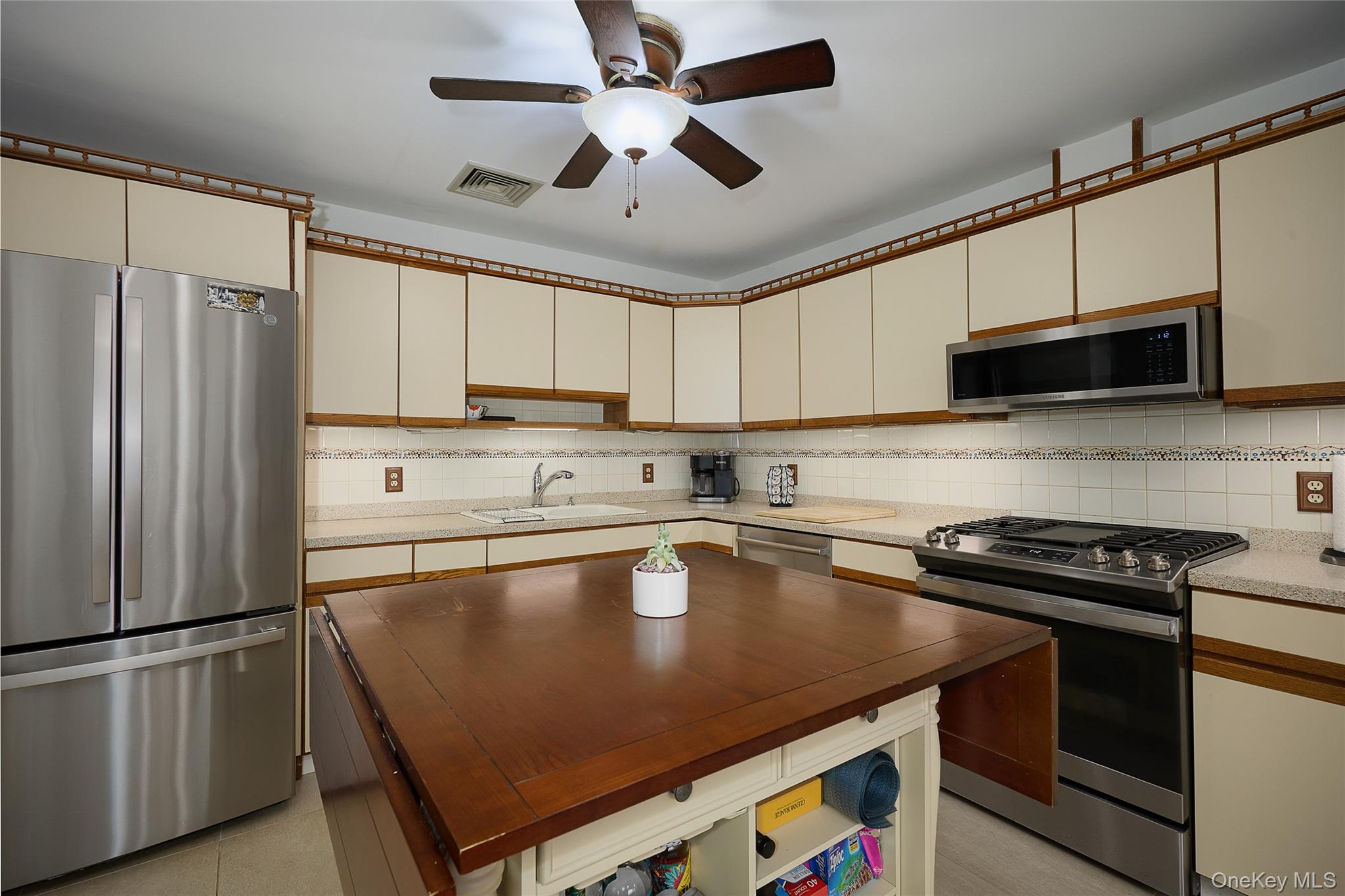 34 Maple Brook Road Tuxedo Park, NY 10987 - Photo 6 of 25 a kitchen with a appliances a sink and cabinets
