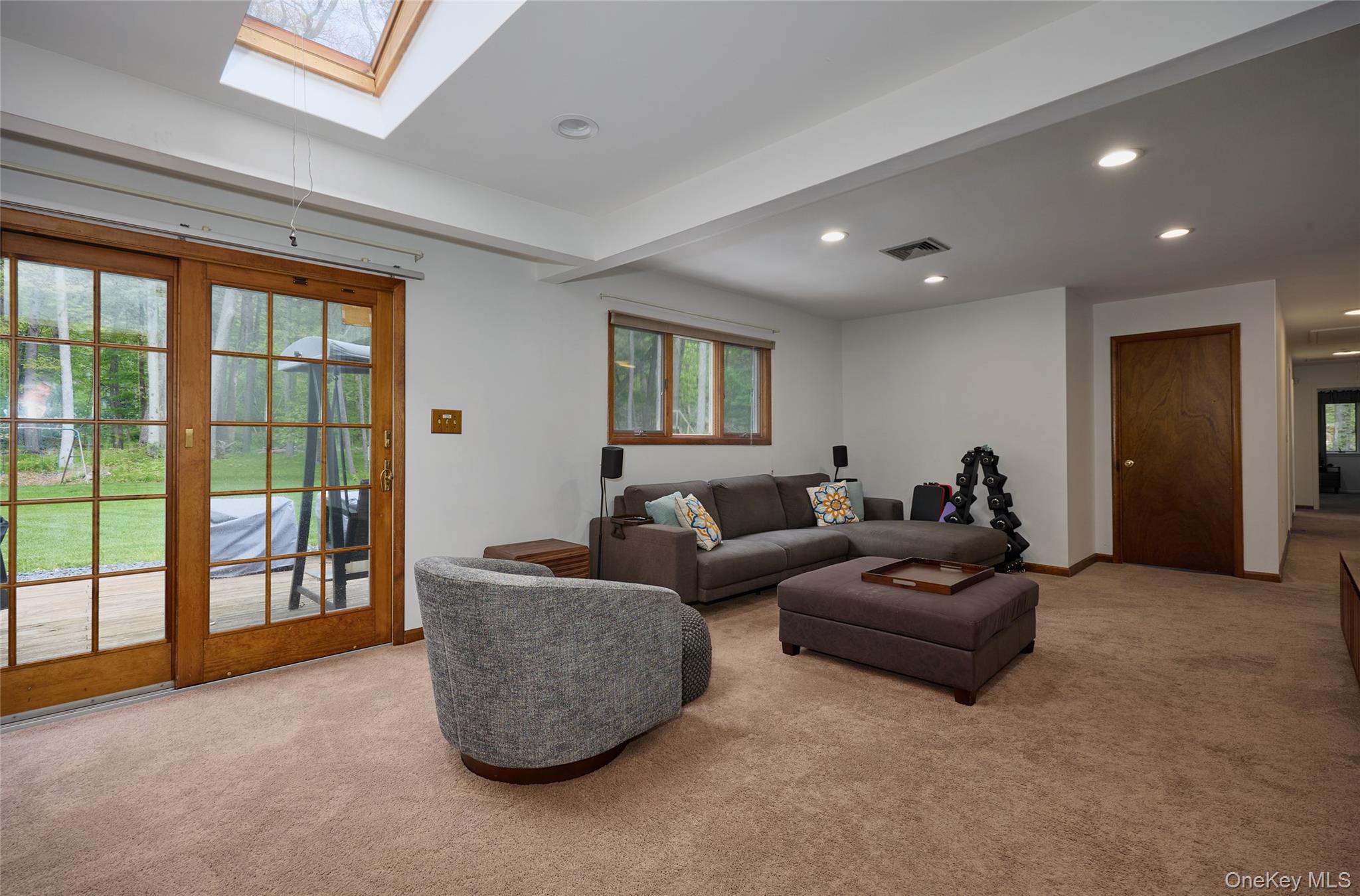 34 Maple Brook Road Tuxedo Park, NY 10987 - Photo 9 of 25 a living room with couches and a flat screen tv