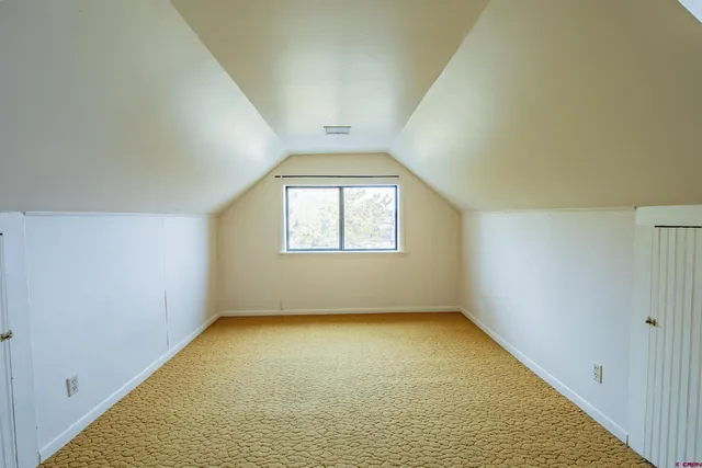 an empty room with a empty space and window