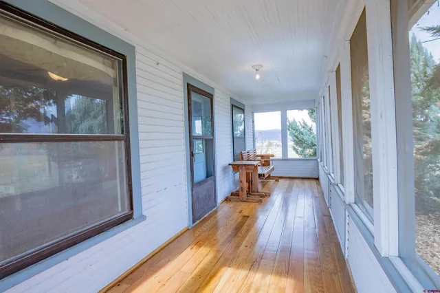 a view of a living room with a wooden floor