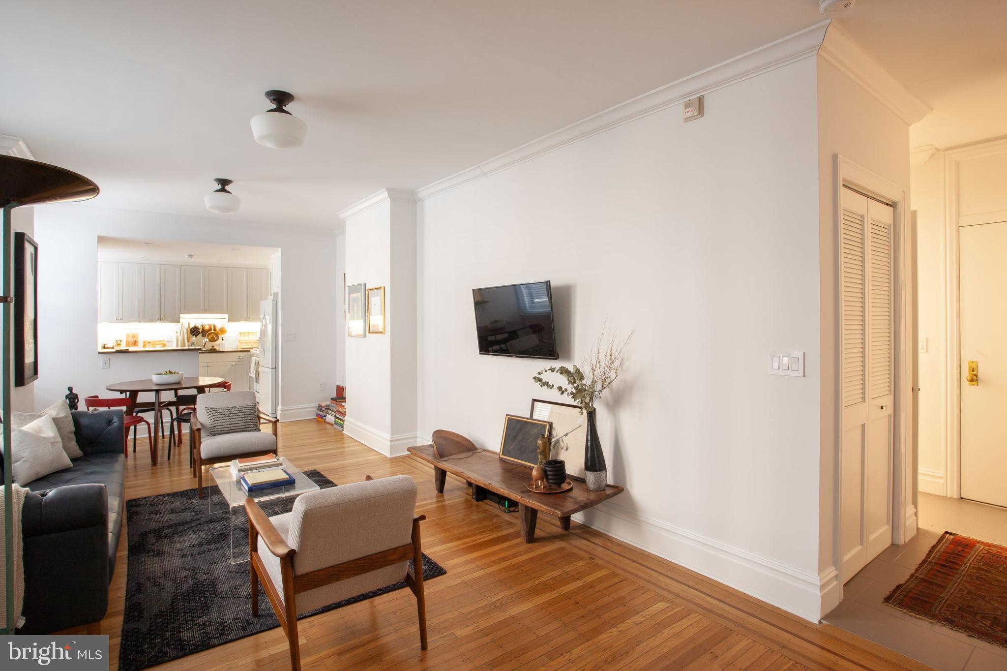 1520-28 Spruce Street, Unit 202 Philadelphia, PA 19102 - Photo 1 of 24 a living room with furniture and a flat screen tv