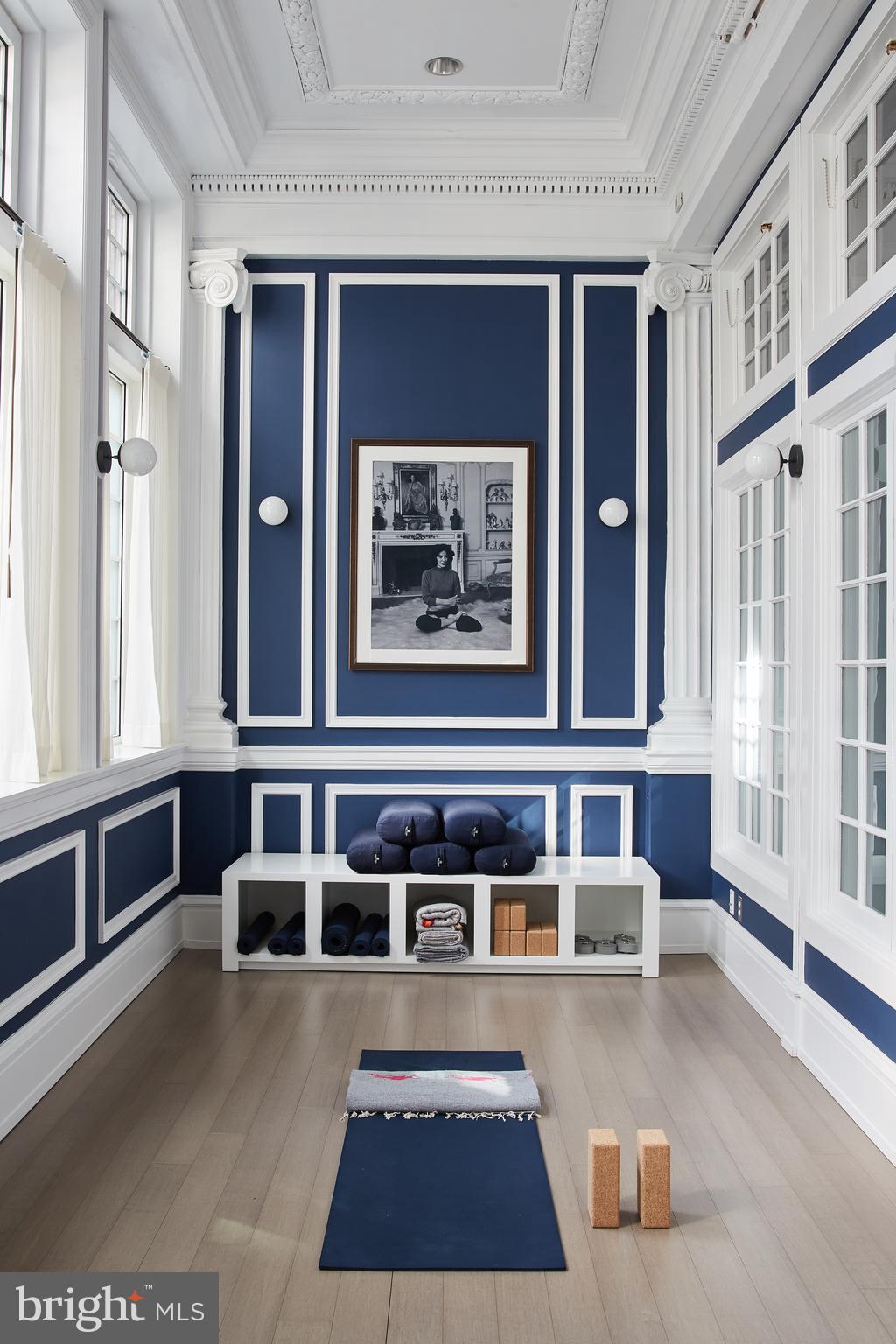 1520-28 Spruce Street, Unit 202 Philadelphia, PA 19102 - Photo 12 of 24 a living room with furniture and a large window
