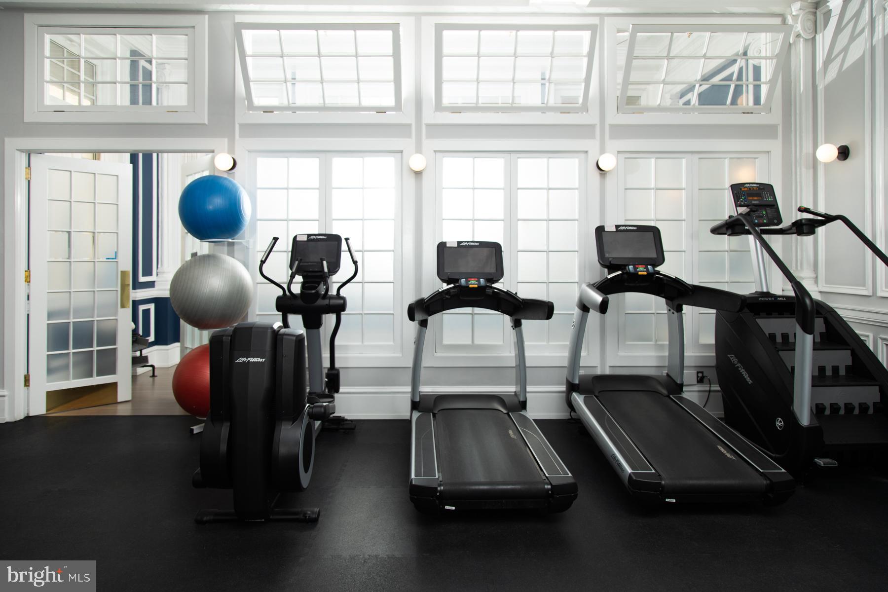 1520-28 Spruce Street, Unit 202 Philadelphia, PA 19102 - Photo 15 of 24 a room with gym equipment and a large window