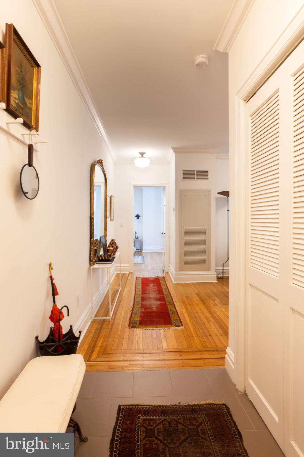 1520-28 Spruce Street, Unit 202 Philadelphia, PA 19102 - Photo 2 of 24 a living room with a couch and a flat screen tv