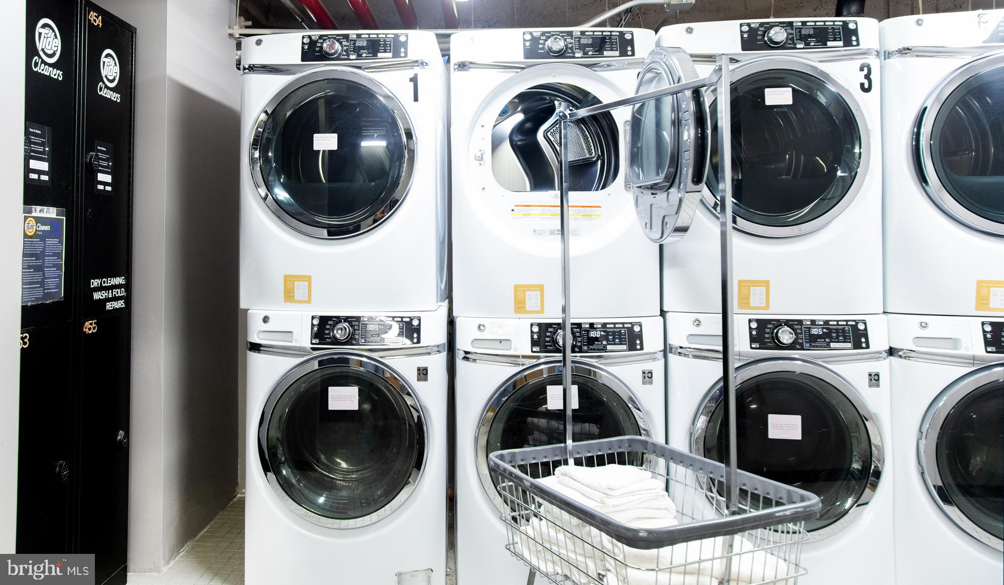 1520-28 Spruce Street, Unit 202 Philadelphia, PA 19102 - Photo 21 of 24 a utility room with dryer and washer