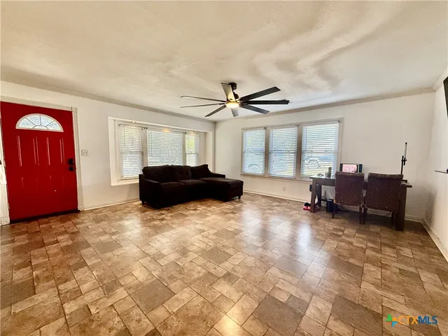 a living room with furniture and a window