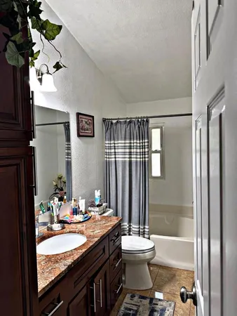 a bathroom with a bathtub a sink and a shower