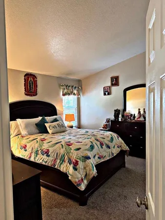 a view of a hallway with wooden shelves