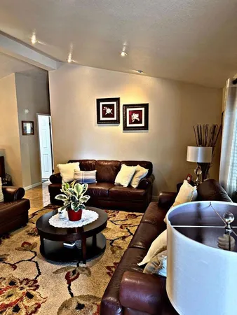 a living room with furniture and a table