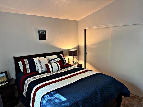 a living room with a flat screen tv and a window