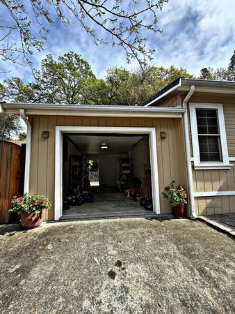 a living room filled with furniture and a window