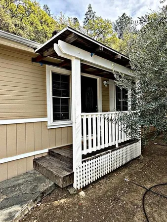 a view of a porch with wooden floor and outdoor space
