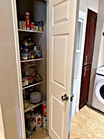 a living room with a stove and a window