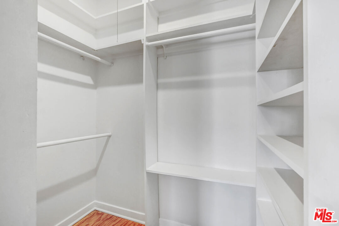 1020 Hi Point Street, Unit 1020 Los Angeles, CA 90035 - Photo 11 of 18 a view of an empty walk in closet