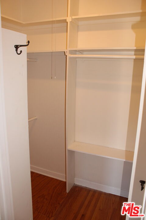 1020 Hi Point Street, Unit 1020 Los Angeles, CA 90035 - Photo 23 of 37 a bathroom with a glass shower door