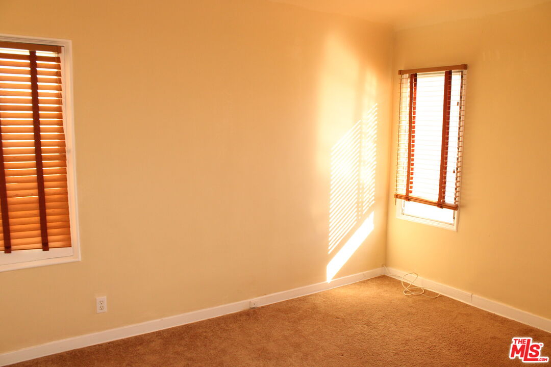 1020 Hi Point Street, Unit 1020 Los Angeles, CA 90035 - Photo 25 of 37 a view of an empty room with a window