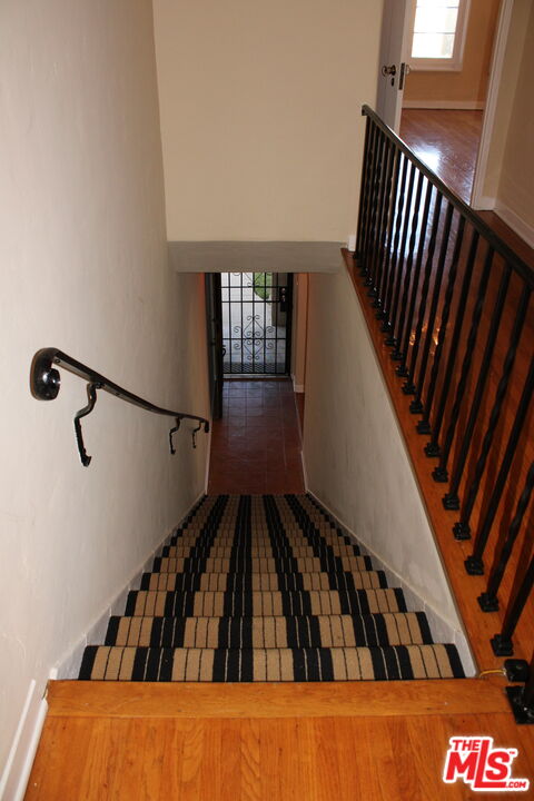1020 Hi Point Street, Unit 1020 Los Angeles, CA 90035 - Photo 26 of 37 a view of staircase with wooden floor