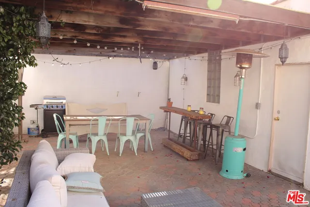 a view of a chairs and tables in the patio