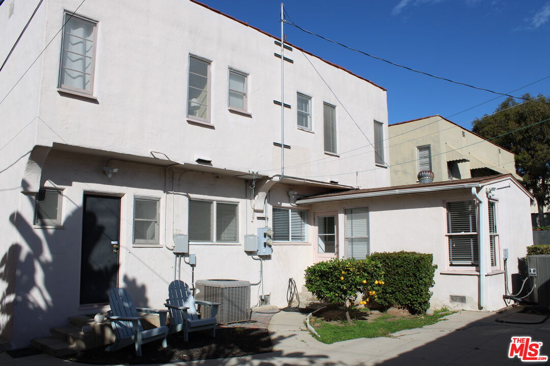 1020 Hi Point Street, Unit 1020 Los Angeles, CA 90035 - Photo 33 of 37 a front view of a house with a yard