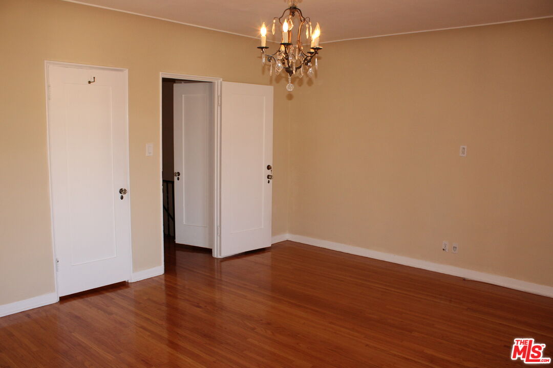1020 Hi Point Street, Unit 1020 Los Angeles, CA 90035 - Photo 36 of 37 a view of a room with wooden floor