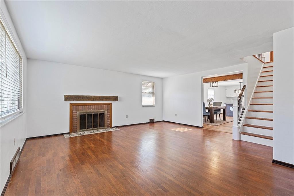 5018 Grove Road Pittsburgh, PA 15234 - Photo 13 of 41 an empty room with wooden floor and windows