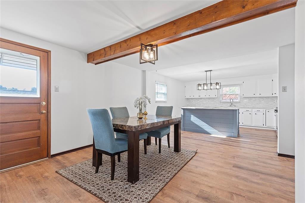 5018 Grove Road Pittsburgh, PA 15234 - Photo 15 of 41 a view of a dining room with furniture