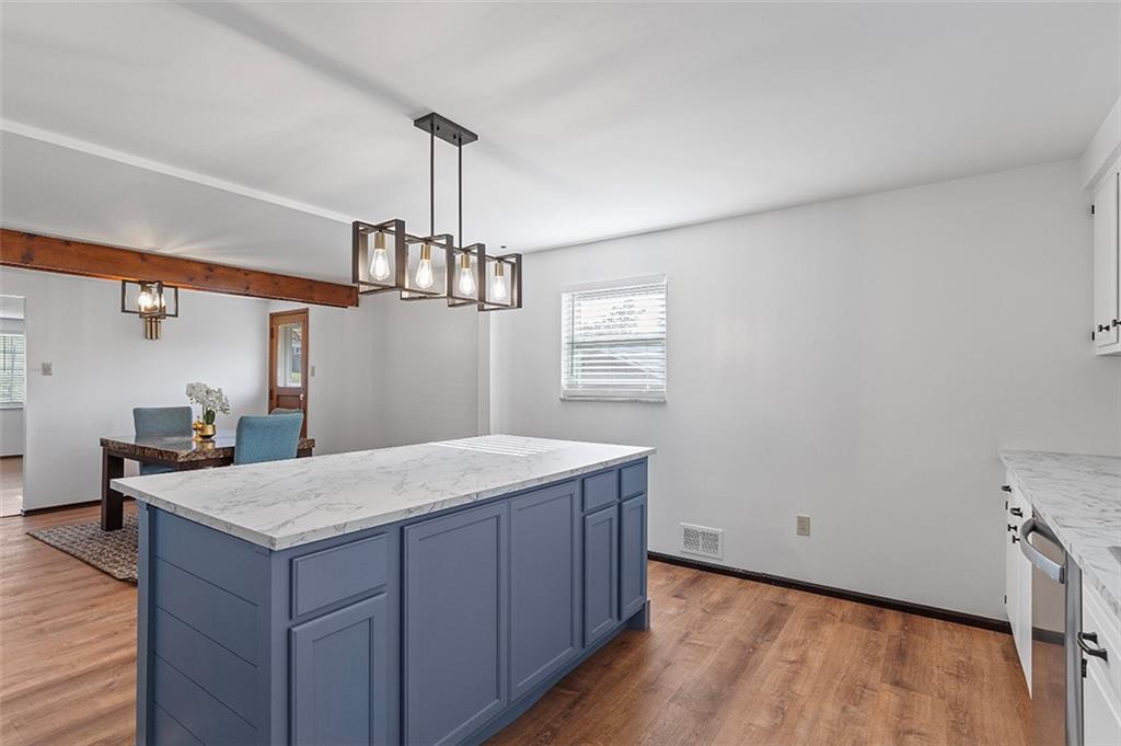 5018 Grove Road Pittsburgh, PA 15234 - Photo 16 of 41 a kitchen with a wooden floor and window