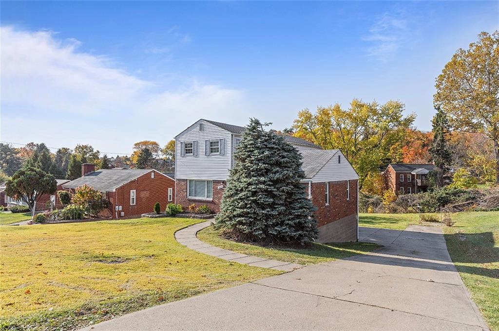 5018 Grove Road Pittsburgh, PA 15234 - Photo 2 of 41 a view of a house with a yard