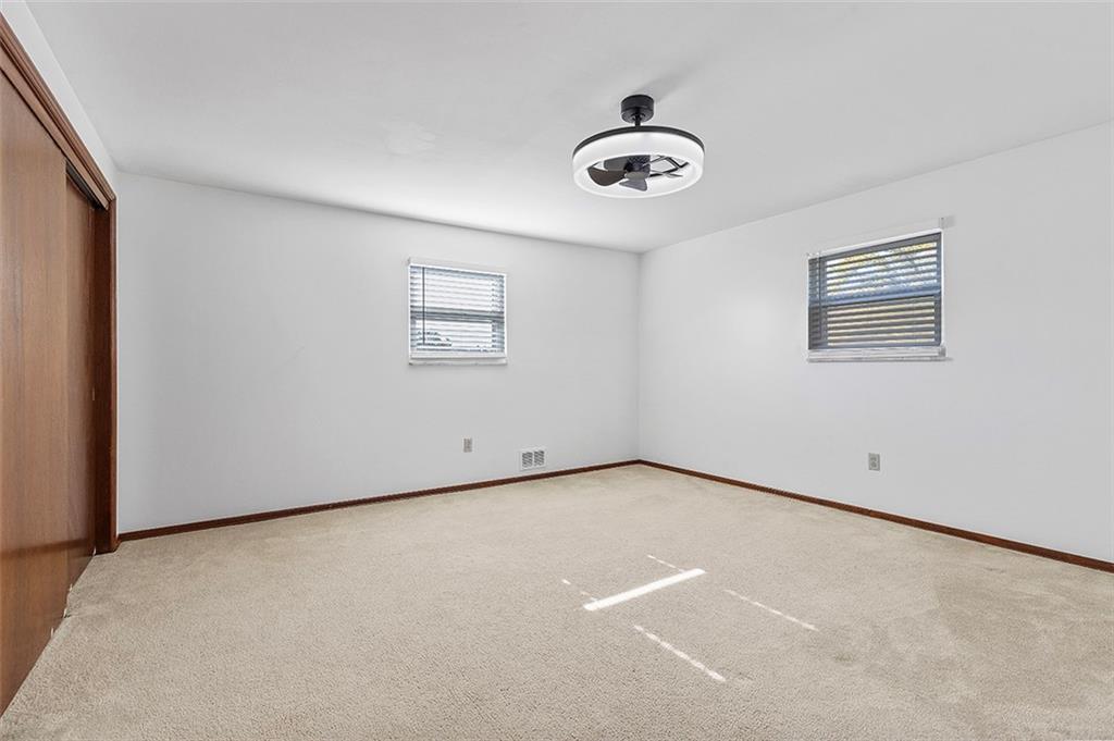 5018 Grove Road Pittsburgh, PA 15234 - Photo 24 of 41 an empty room with a empty space and windows