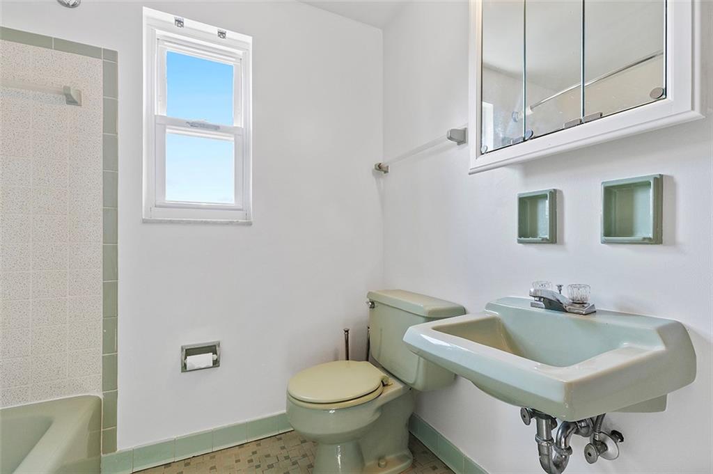 5018 Grove Road Pittsburgh, PA 15234 - Photo 29 of 41 a bathroom with a sink a toilet and a mirror