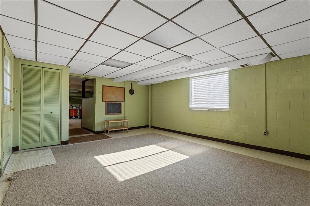 5018 Grove Road Pittsburgh, PA 15234 - Photo 32 of 41 an empty room with windows