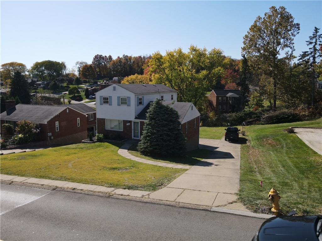 5018 Grove Road Pittsburgh, PA 15234 - Photo 33 of 41 a view of a house with a yard