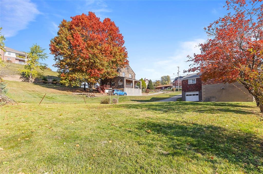 5018 Grove Road Pittsburgh, PA 15234 - Photo 7 of 41 a house view with swimming pool in front of it