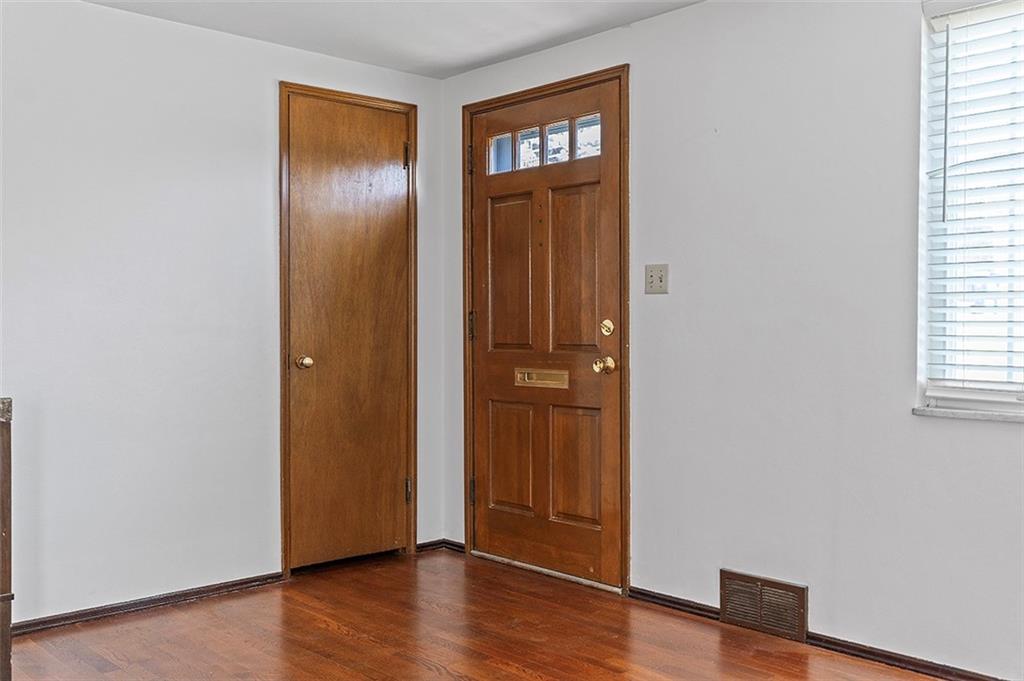 5018 Grove Road Pittsburgh, PA 15234 - Photo 10 of 41 an empty room with wooden floor closet and windows