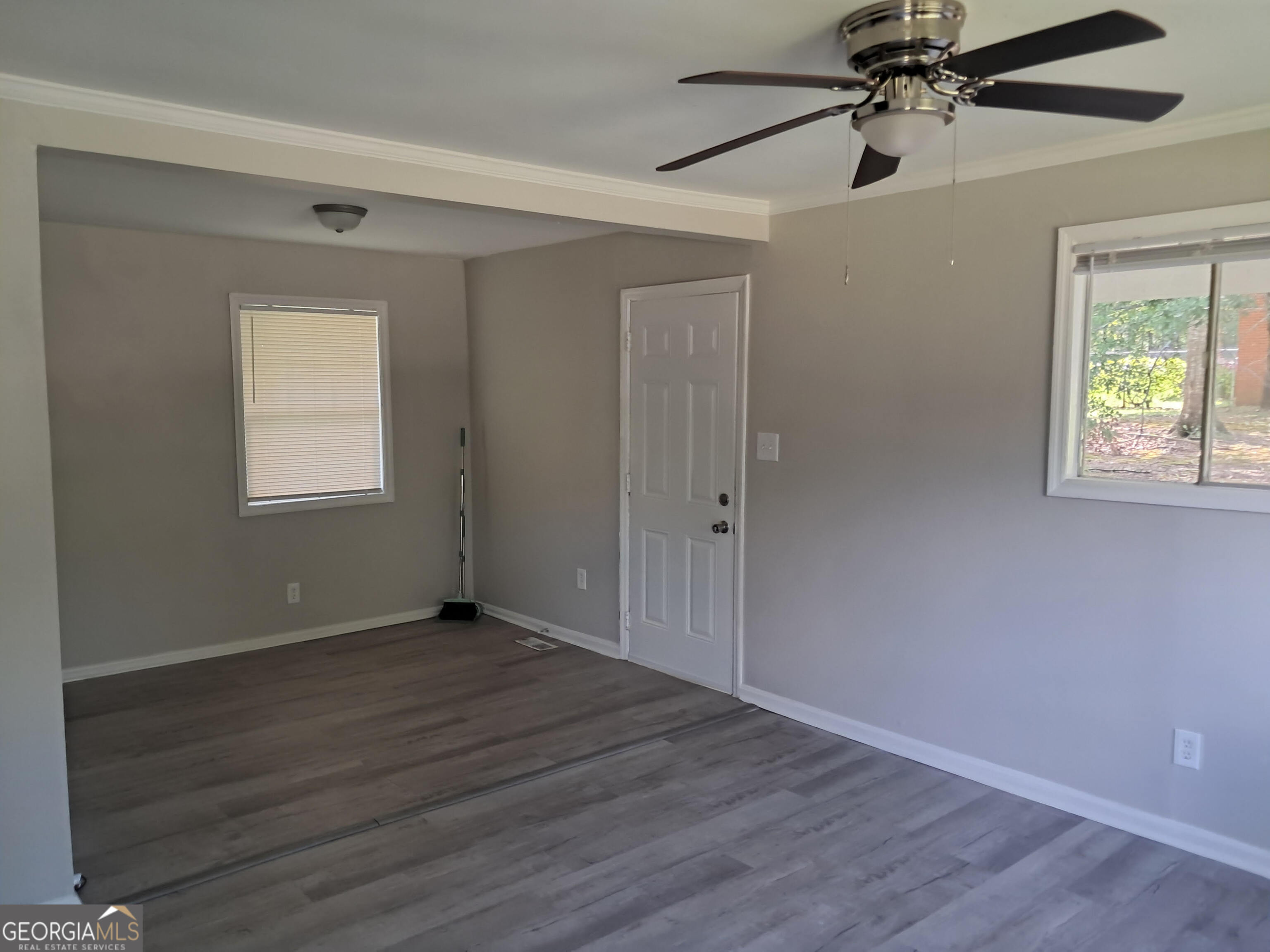 193 Frazier Drive Southeast Milledgeville, GA 31061 - Photo 16 of 38 a view of an empty room with wooden floor and a window