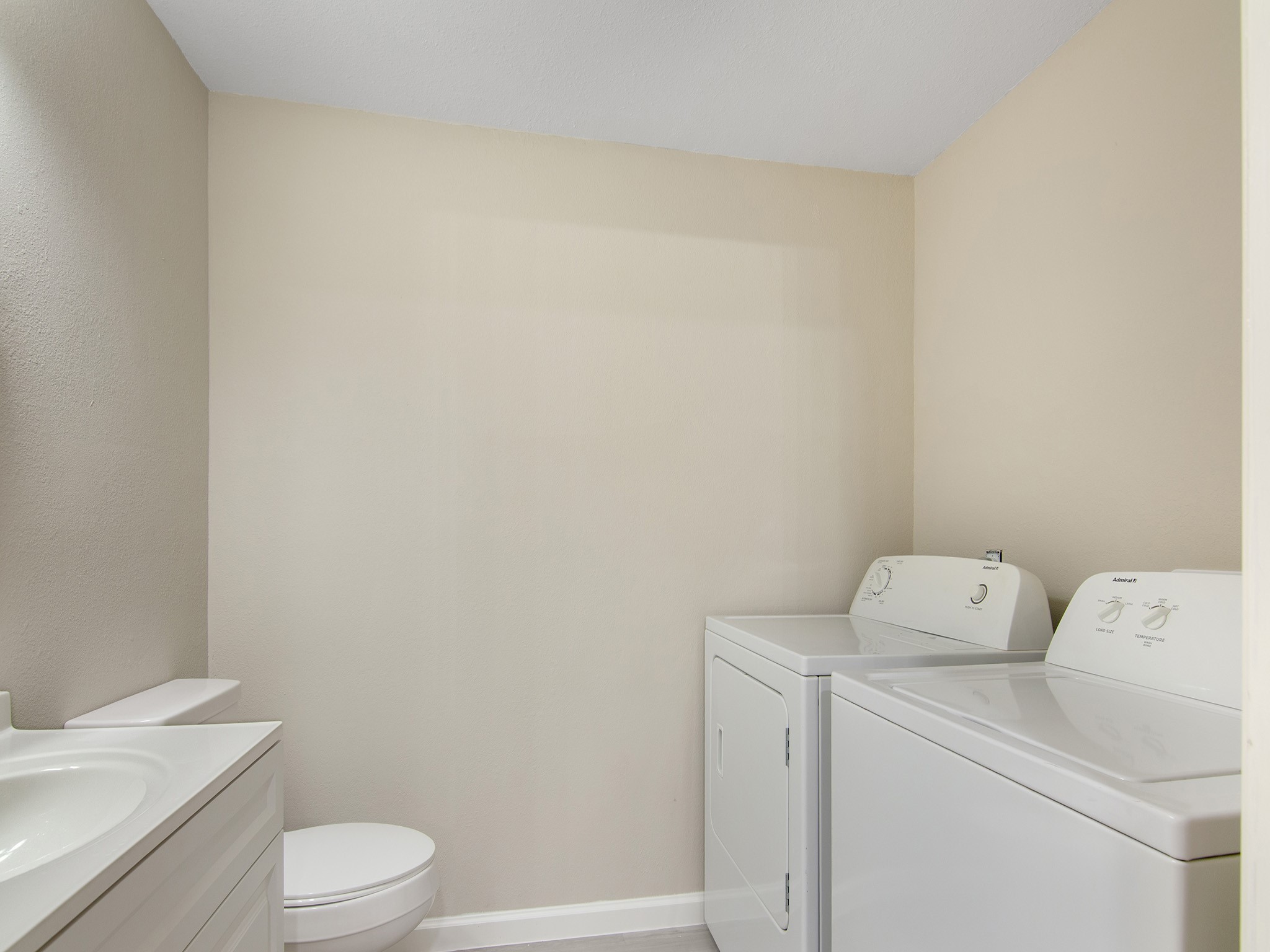 11624 Village Pl Drive, Unit 327 Houston, TX 77077 - Photo 14 of 24 a white toilet sitting next to a white sink