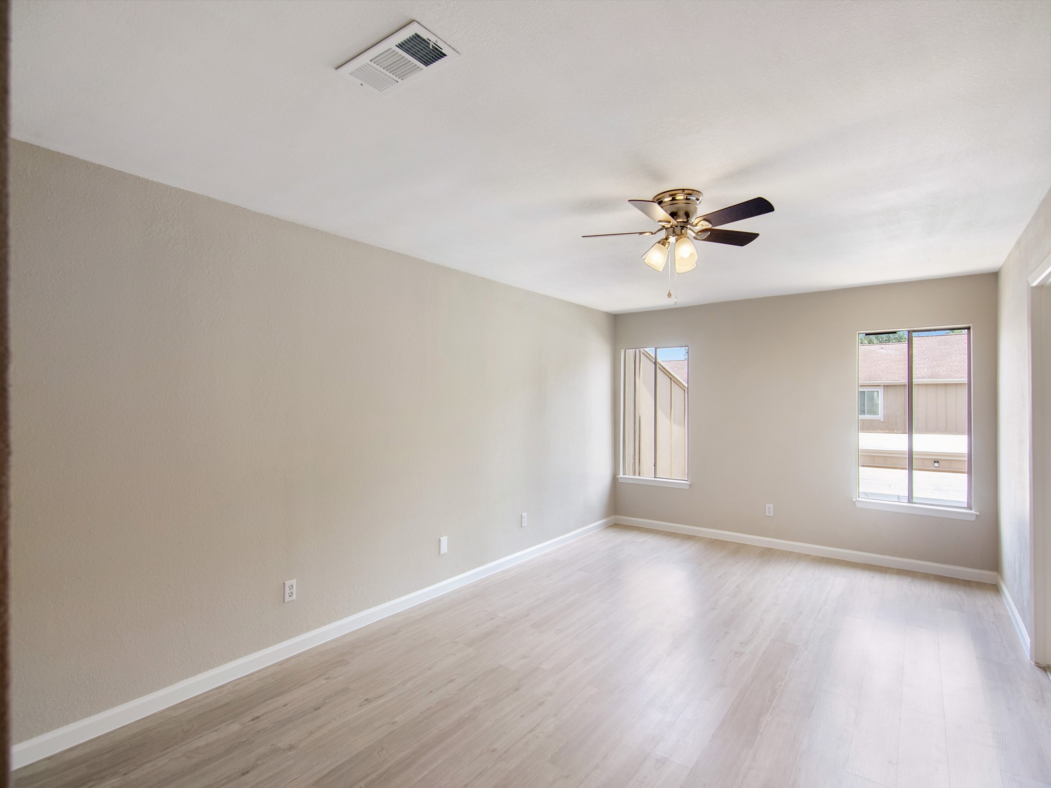 11624 Village Pl Drive, Unit 327 Houston, TX 77077 - Photo 16 of 24 wooden floor in an empty room with a window