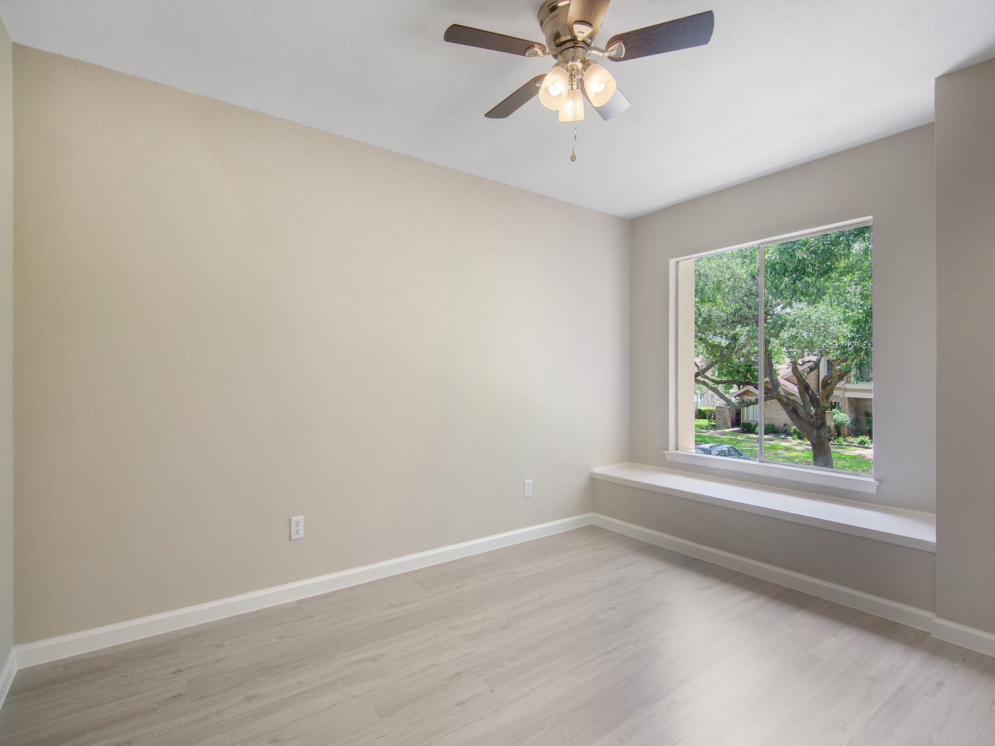 11624 Village Pl Drive, Unit 327 Houston, TX 77077 - Photo 20 of 24 an empty room with a window and a fan