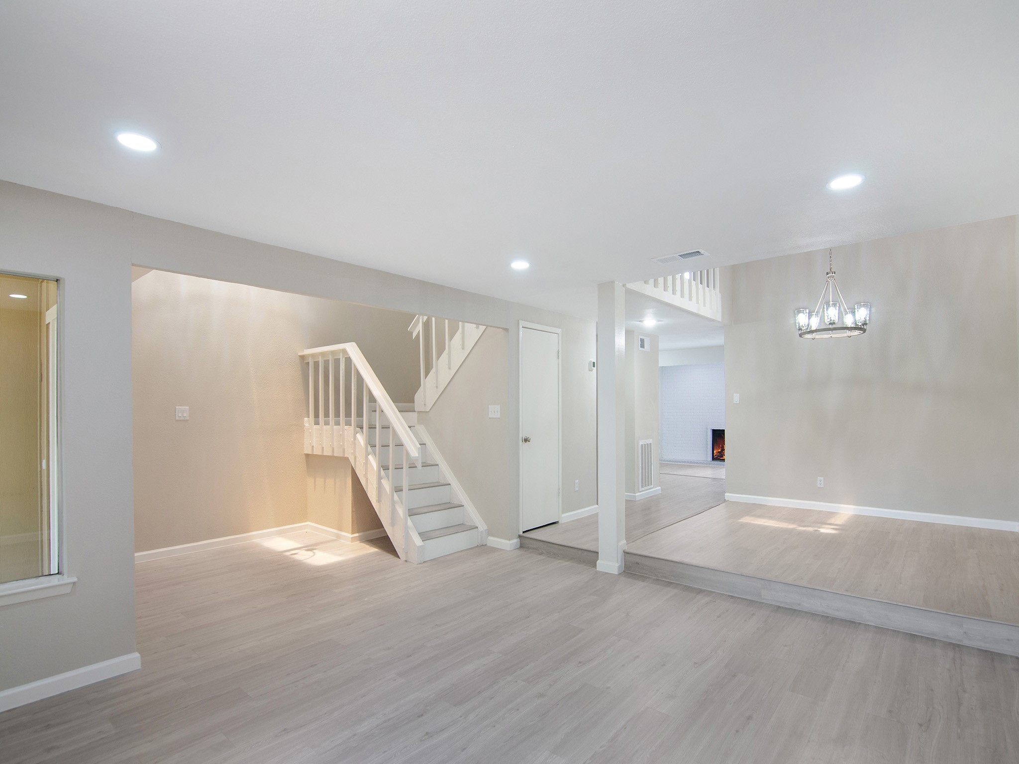 11624 Village Pl Drive, Unit 327 Houston, TX 77077 - Photo 5 of 24 an empty room with wooden floor and windows