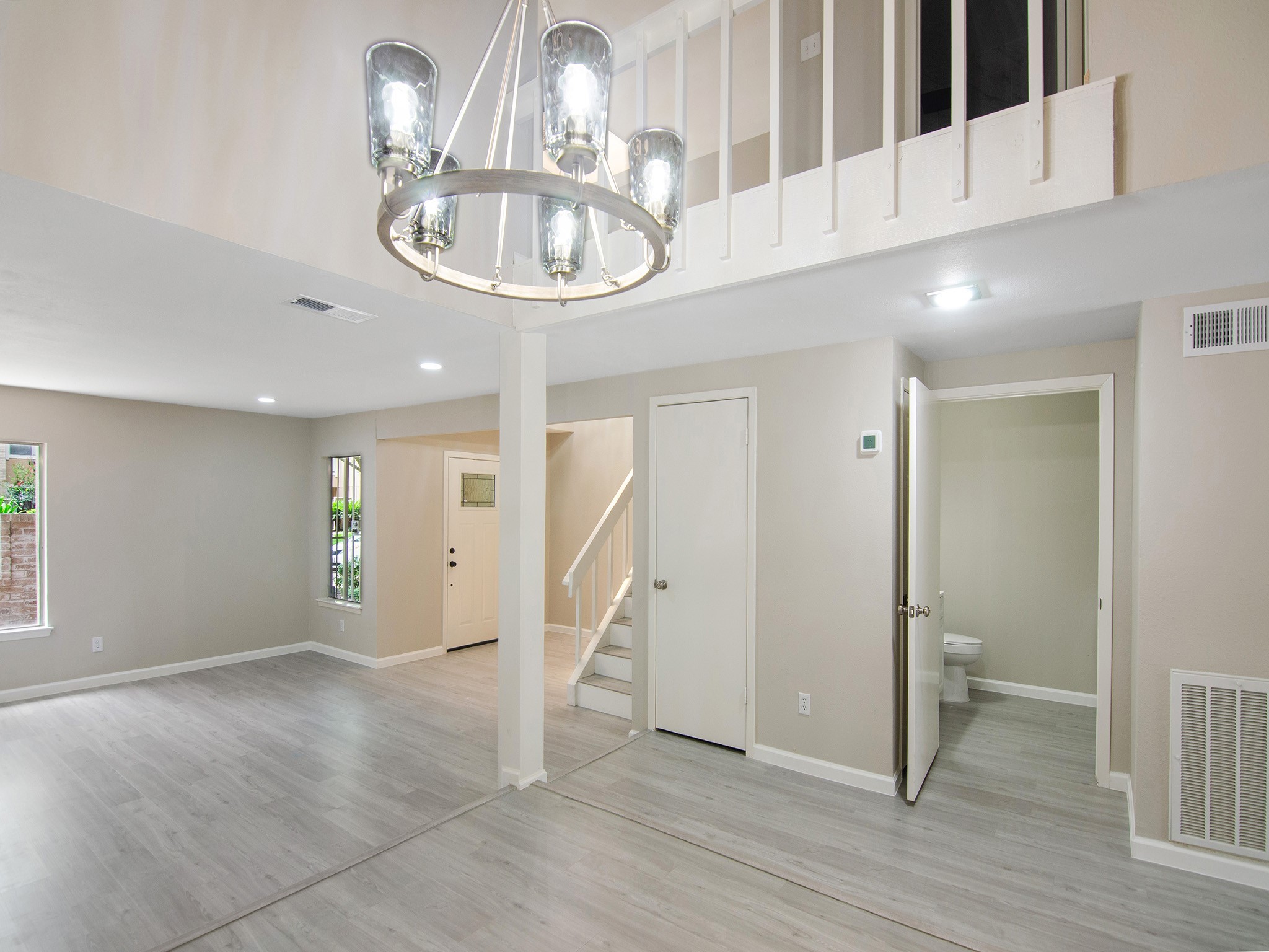 11624 Village Pl Drive, Unit 327 Houston, TX 77077 - Photo 7 of 24 wooden floor in an empty room with a window