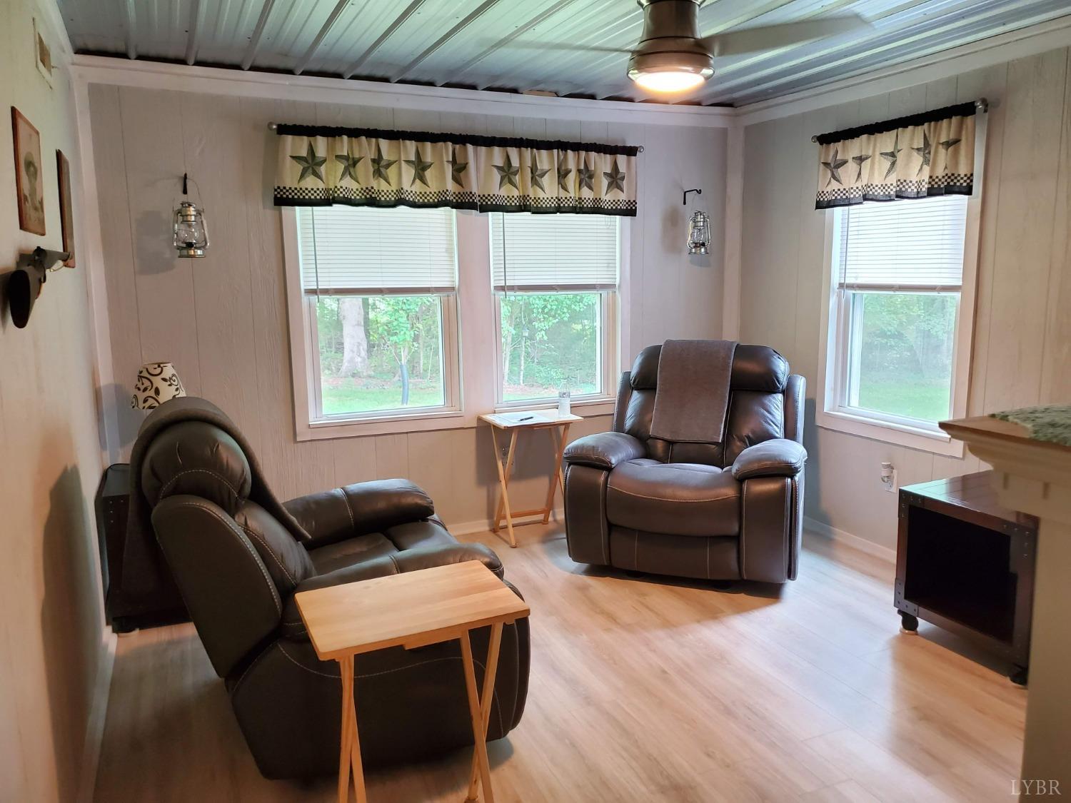 2237 Wards Corner Road Keysville, VA 23947 - Photo 14 of 20 a living room with furniture and a large window