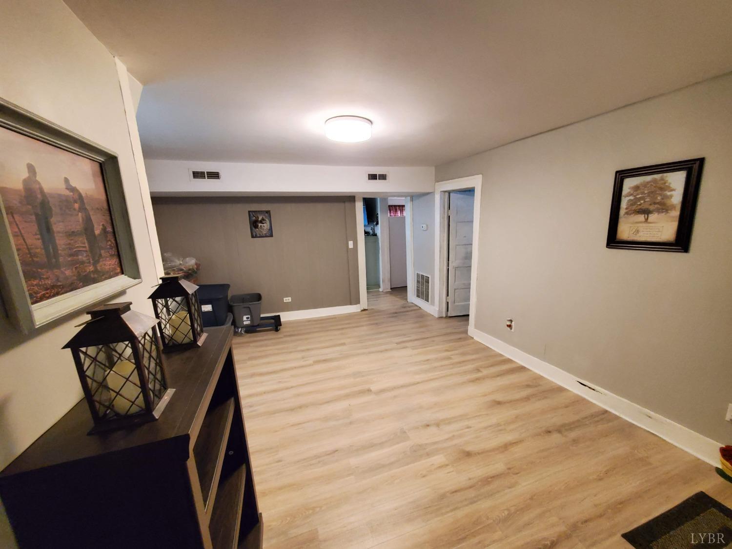 2237 Wards Corner Road Keysville, VA 23947 - Photo 8 of 20 a room with furniture and a flat screen tv