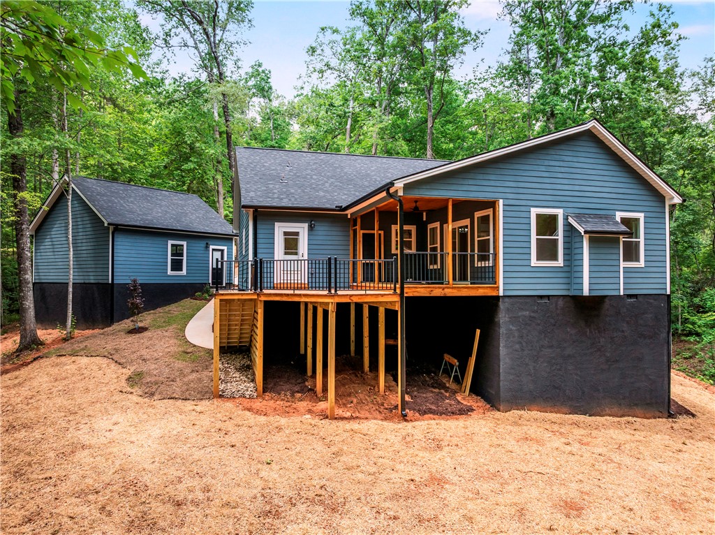 110 Gabriel Way Pickens, SC 29671 - Photo 2 of 48 Perched among verdant trees, this tranquil residence boasts an elevated deck and an additional structure.
