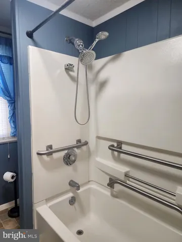 a bathroom with a shower and a sink
