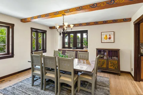 a dining room with furniture and window