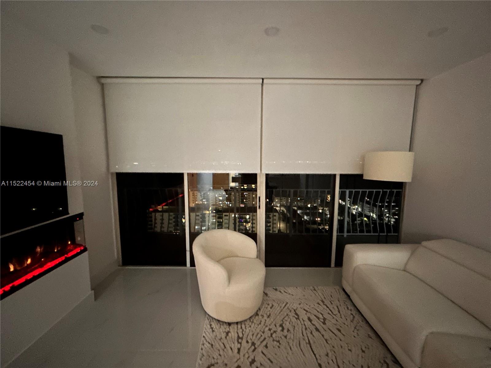 7601 East Treasure Drive, Unit PH206 North Bay Village, FL 33141 - Photo 11 of 24 a kitchen with a refrigerator and cabinets