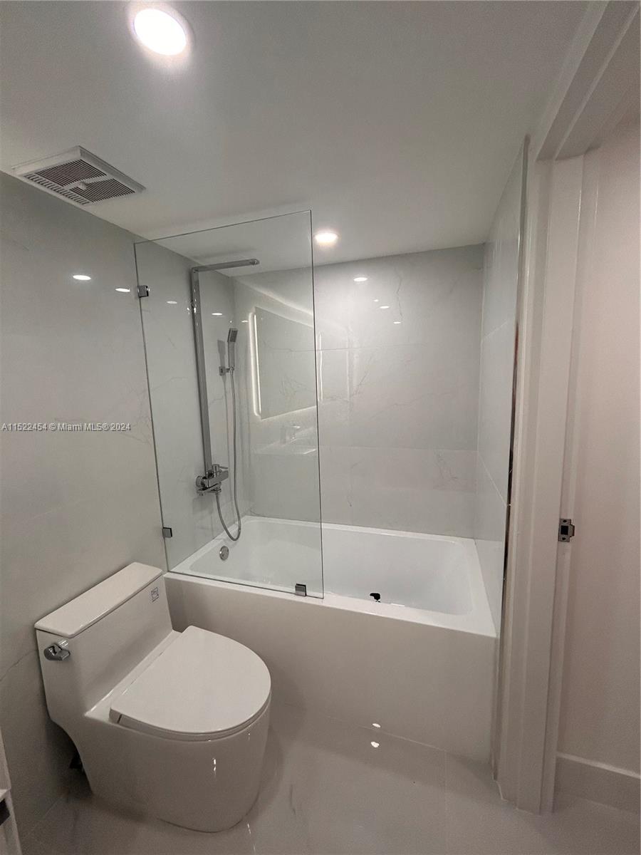 7601 East Treasure Drive, Unit PH206 North Bay Village, FL 33141 - Photo 17 of 24 a bathroom with a sink and a mirror